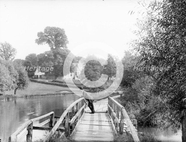 A man leaning on the handrail of the last footbridge, Iffley, Oxford, Oxfordshire, 1885. Artist: Henry Taunt