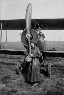 Katherine Stinson with her biplane, 1917 or 1918. Creator: Bain News Service.