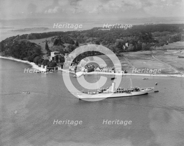 Montague Grahame-White's steam yacht 'Alacrity' and Brownsea Island, Dorset, from the east, 1933. Artist: Aerofilms.