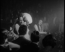 Female Civilian Singing in a Nightclub. She Walks Towards a Male Civilian and Dances in..., 1924. Creator: British Pathe Ltd.