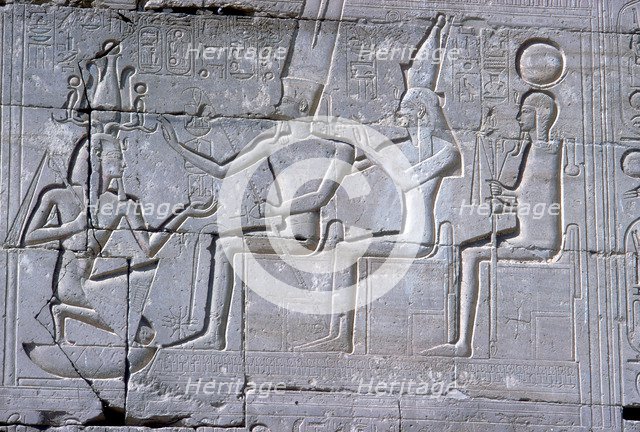 Relief of Rameses II kneeling before Amun Mut & Khons, The Ramesseum, Luxor, Egypt, c1250 BC. Artist: Unknown