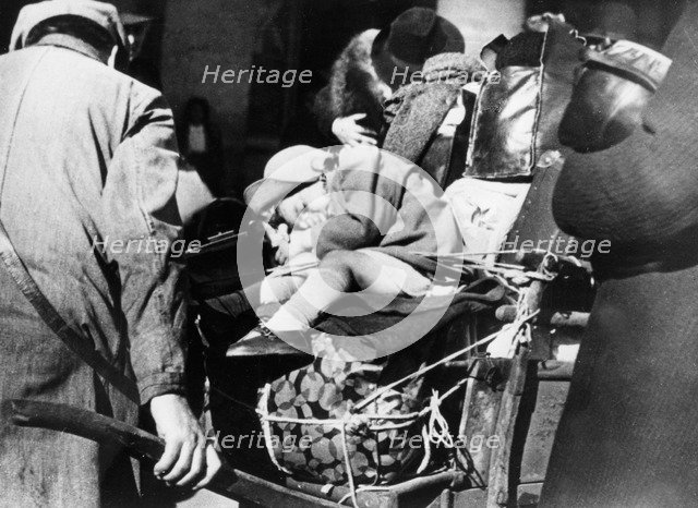 Refugees with their luggage at the Gare de l'Est, Paris, August 1940. Artist: Unknown