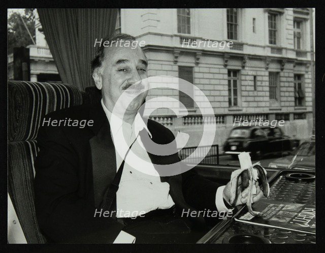 Guitarist Chuck Christiansen travelling by coach to the Royal Albert Hall, London, 28 May 1992. Artist: Denis Williams