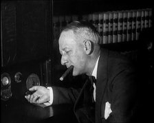 Al Smith, Former Presidential Candidate, Smoking a Cigar And Following Election Results..., 1932. Creator: British Pathe Ltd.