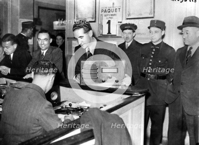 French Jews forced to hand in their radio sets to the police, occupied Paris, September 1941. Artist: Unknown