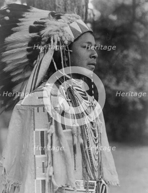Youth in holiday costume-Umatilla, c1910. Creator: Edward Sheriff Curtis.