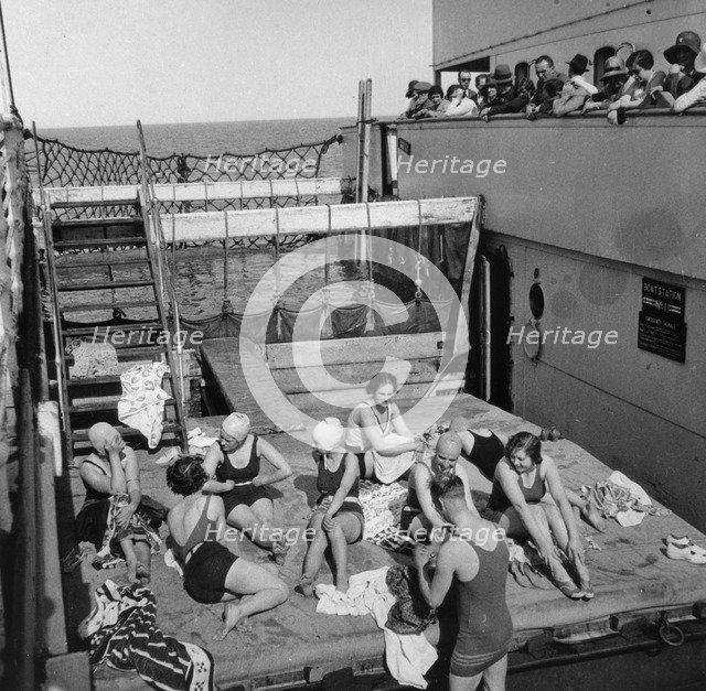Passengers sunbathing on a Cunard Line cruise to the West Indies, January-March 1931. Artist: Unknown