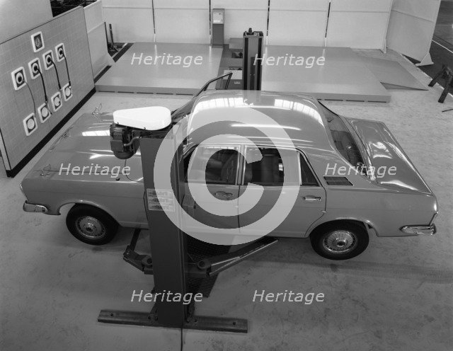 Ford Zodiac on an asymmetric lift, Sheffield, South Yorkshire, 1972.  Artist: Michael Walters