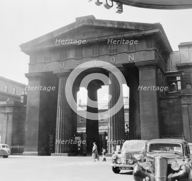 Arch outside the main entrance to Euston Station, Camden, London, 1952. Artist: Henry Grant