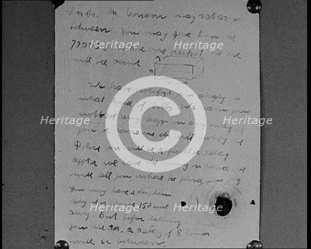 Notes of Ransom Being Shown as Articles of Evidence in the Lindbergh's Kidnapping Case Trial, 1930s. Creator: British Pathe Ltd.