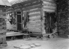 Construction detail of double log cabin of Negro share tenants, Person County, North Carolina, 1939. Creator: Dorothea Lange.
