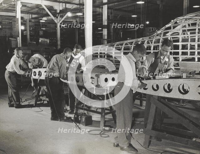 Manpower: Negro bomber plant workers, 1942-05. Creator: Howard Liberman.