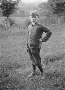 Unidentified child, standing outdoors, between 1896 and 1942. Creator: Arnold Genthe.