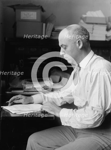 Unknown politician at desk, 1912. Creator: Harris & Ewing.