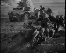 German Soldiers Advancing Through Dusty Fields on Military Vehicles To Cut Off Allied Units..., 1940 Creator: British Pathe Ltd.