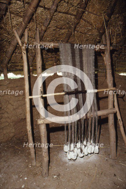 Loom with chalk loom weights, Butser Iron Age Farm, c20th century. Artist: CM Dixon.