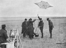 'Sending up one of the French war kites, to which a camera is attached', 1914, (1915). Artist: Unknown.