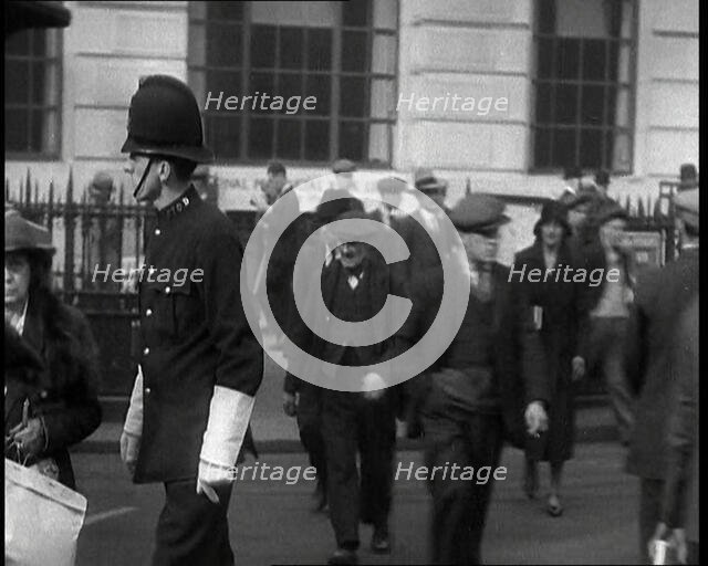 A Police Officer Guiding Traffic on the Streets of London, 1936. Creator: British Pathe Ltd.