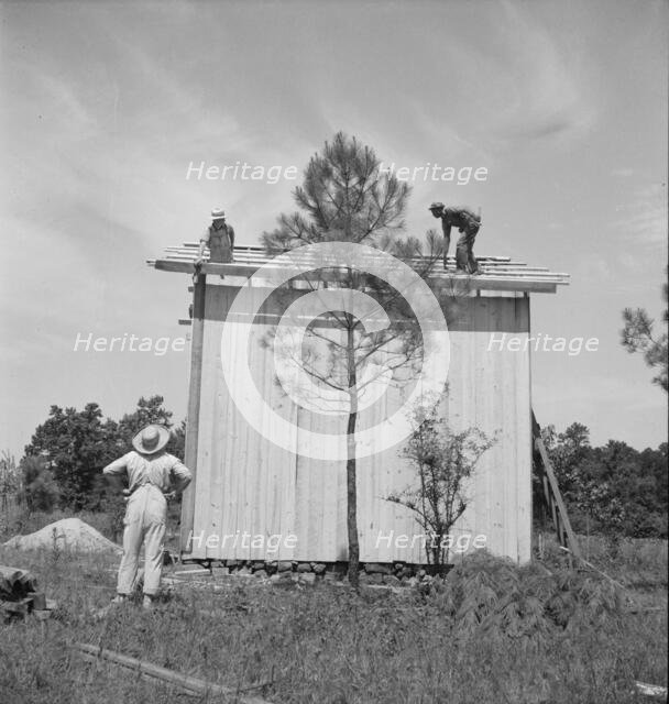 Building plank tobacco barn to replace old log one, near Chapel Hill, North Carolina, 1939 Creator: Dorothea Lange.