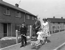Street scene with family, Ollerton, North Nottinghamshire, 11th July 1962. Artist: Michael Walters
