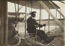 Wilbur Wright in the flyer, 1908. Creator: Anonymous.