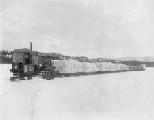Caterpillar hauling freight on the lake in spring to the Yukon, between c1900 and c1930. Creator: Unknown.