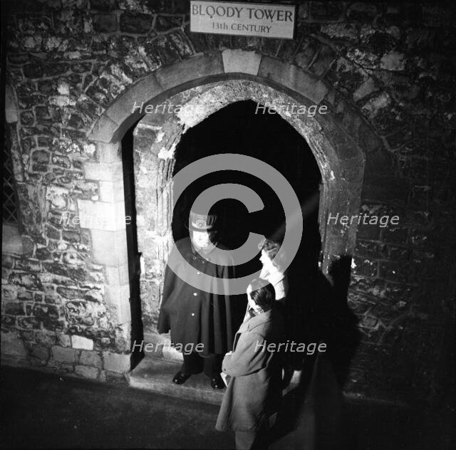 Yeoman Warder and visitors at the Bloody Tower, Tower of London, c1955. Creator: Arthur Charles Kirby Ware.