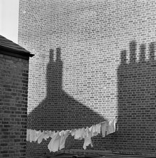 Shadows and laundry, London, 1964. Artist: John Gay