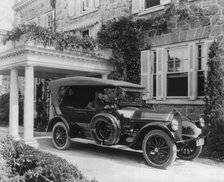 Automobile owned by Mrs. Charles W. Richardson in driveway with driver at the...Washington DC, c1919 Creator: Frances Benjamin Johnston.