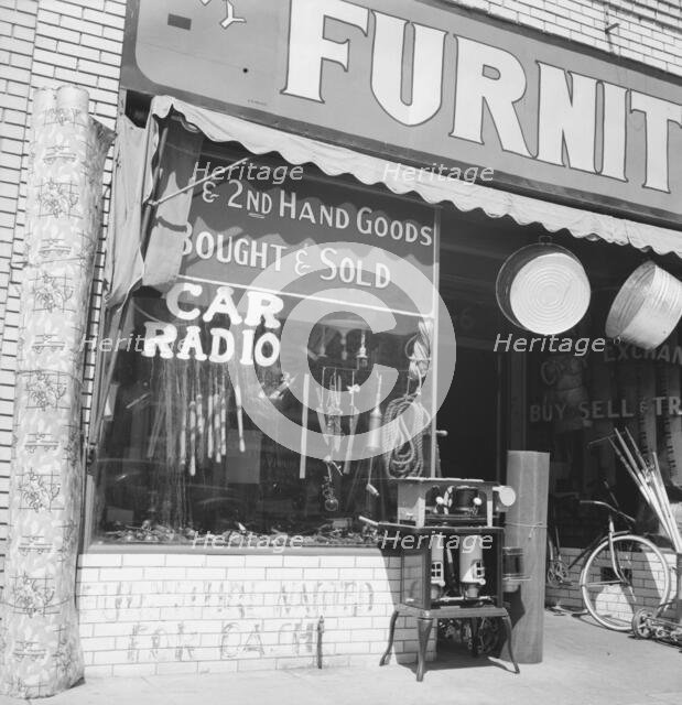 Storefront of San Joaquin Valley town, Fresno, on U.S. 99, California, 1939. Creator: Dorothea Lange.