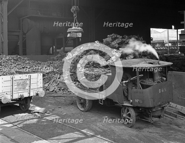 Loading a steam wagon with scrap at a steel foundry, Sheffield, South Yorkshire, 1965. Artist: Michael Walters