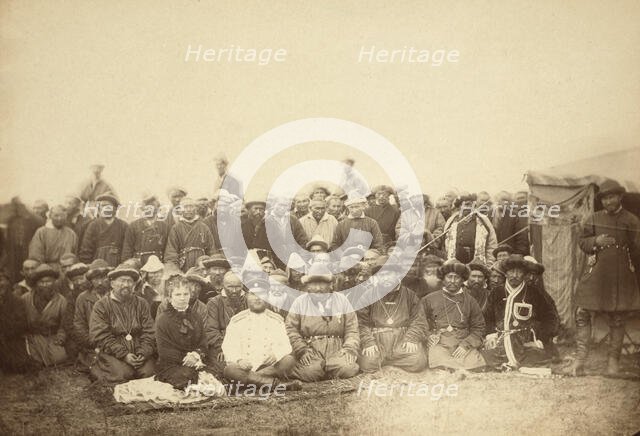 Kirghiz (ie Kazakh) tribesmen with a local Russian Governor and his wife, between 1885 and 1886. Creator: Unknown.