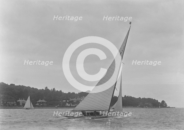 The 6 Metre class 'Maid Marion' (K22) sailing close-hauled, 1921. Creator: Kirk & Sons of Cowes.