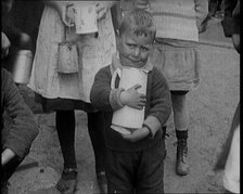 A Boy Clutching a Jug To His Chest and Crying, 1924. Creator: British Pathe Ltd.