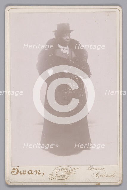 Cabinet card of an unidentified woman wearing a top hat and a fur stole, ca. 1895. Creator: Justus C. Swan.