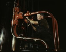 Maintenance man at the Combustion Engineering Co. working at the largest...Chattanooga, Tenn., 1942. Creator: Alfred T Palmer.