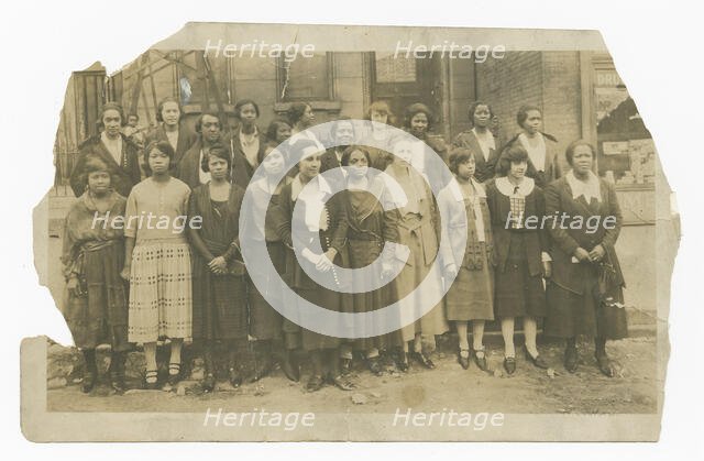 Photograph of Lucille Brown among Poro agents and one small child, 1915-1953. Creator: Unknown.