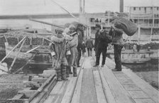 Eskimos on a dock, between c1900 and 1916. Creator: Unknown.