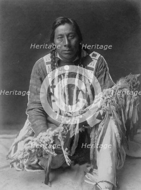 A medicine pipe-Piegan, c1910. Creator: Edward Sheriff Curtis.