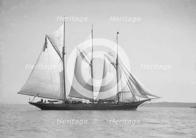 The three-mast auxiliary schooner 'Invincible', 1911. Creator: Kirk & Sons of Cowes.