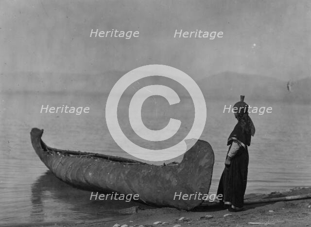On the shore of the lake-Kutenai, c1910. Creator: Edward Sheriff Curtis.