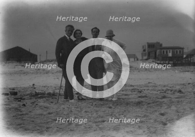 Arnold Genthe with friends in Long Beach, New York, between 1911 and 1942. Creator: Arnold Genthe.