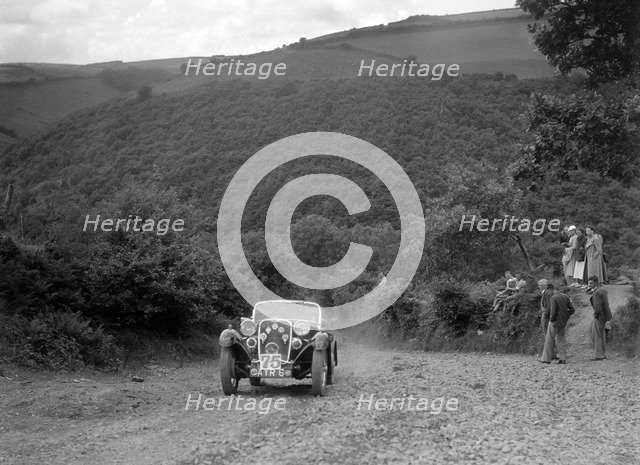 Singer sports competing in the Mid Surrey AC Barnstaple Trial, Beggars Roost, Devon, 1934. Artist: Bill Brunell.