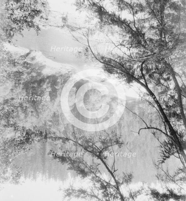 Landscape view of a wooded valley with a river, between 1911 and 1942. Creator: Arnold Genthe.