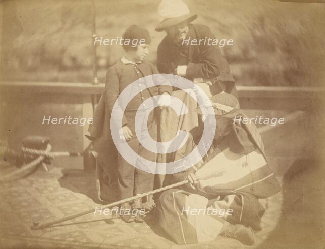 Group Portrait of Two Occidental Men and a Boy on a Boat in the Nile River, 1865. Creator: Théodule Deveria.
