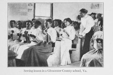 Sewing lesson in a Gloucester County school, Va., 1915. Creator: Unknown.