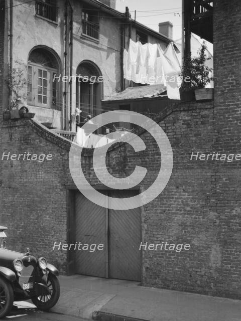 Courtyard with a garage, New Orleans, between 1920 and 1926. Creator: Arnold Genthe.