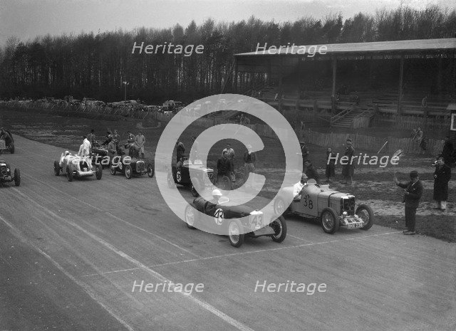 Riley Brooklands of H Hodgson and MG Magnette of H Levy, Donington Park, Leicestershire, 1935. Artist: Bill Brunell.
