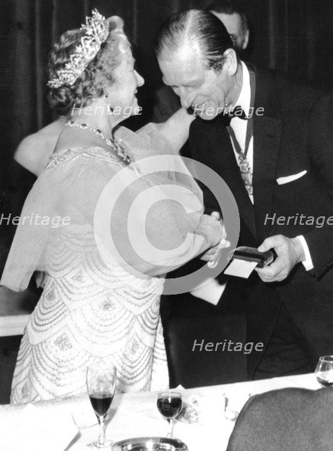 Prince Philip presents the Queen Mother with the Albert Medal, Royal Society of Arts, London, 1974. Creator: Unknown.