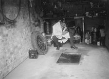 FA Thatcher in his garage. Artist: Bill Brunell.